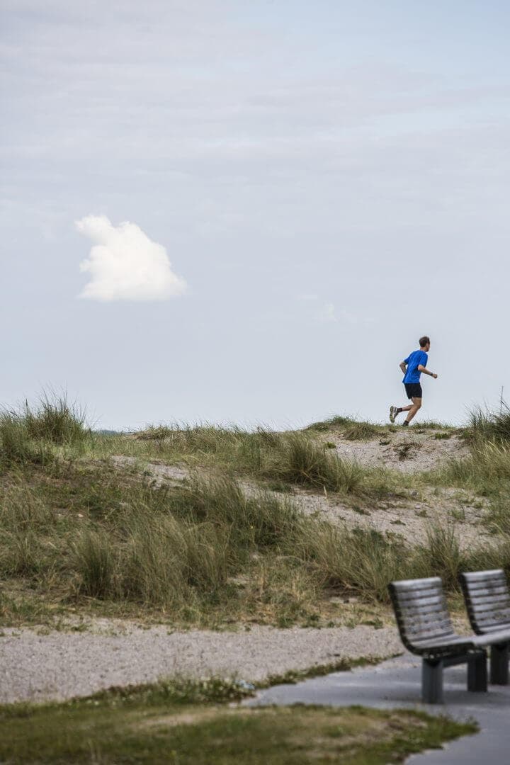 A man running in the dunes