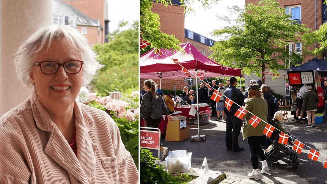 Lise Rasmussen stands on her terrace during the celebration at Østerfælled Torv.