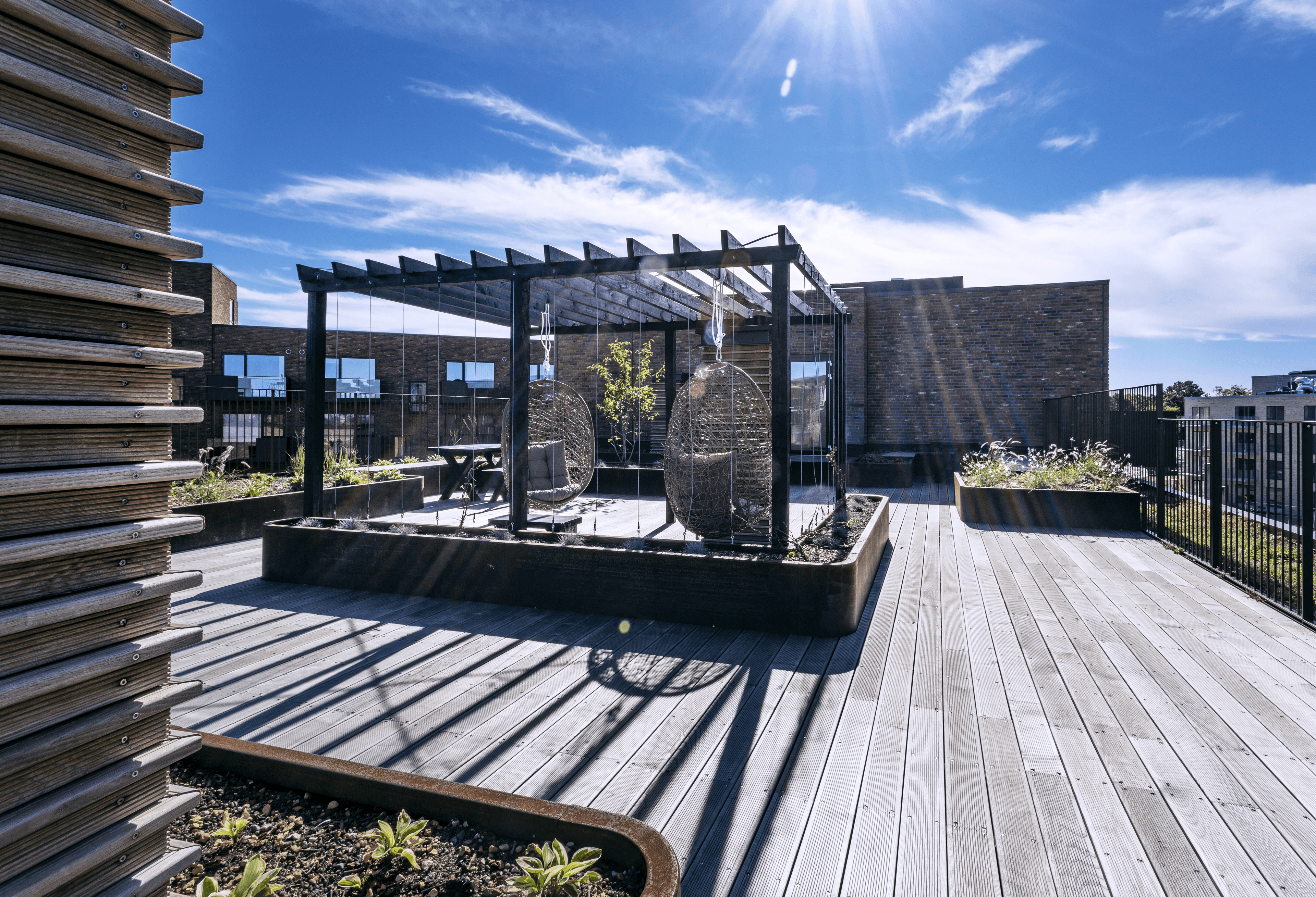 Exterior view of the rooftop terrace at Carlsbakken, showing the outdoor seating area.